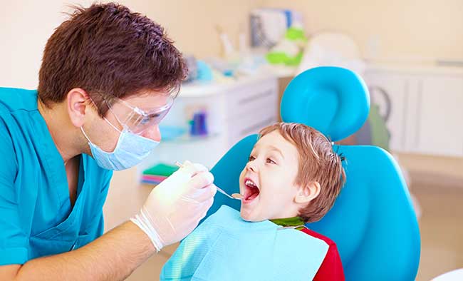 Dentist with Child Patient